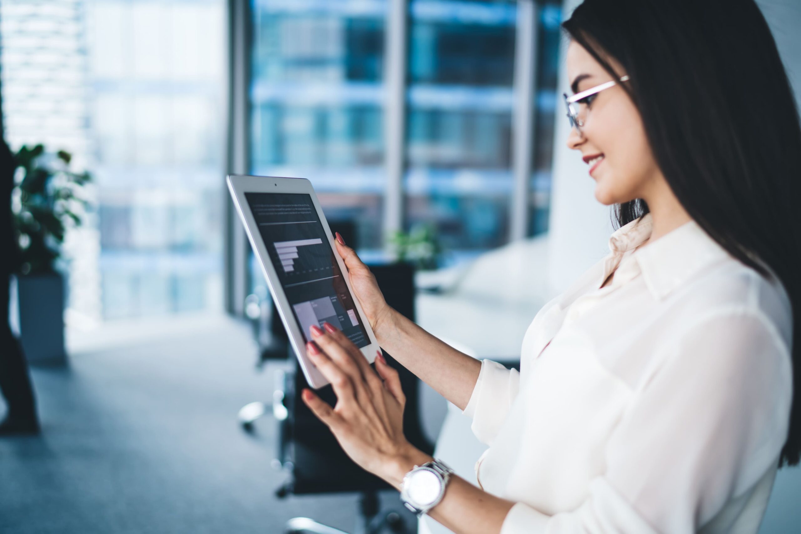 woman-reviews-charts-on-a-tablet-in-office-2026-01-09-08-01-18-utc (1)