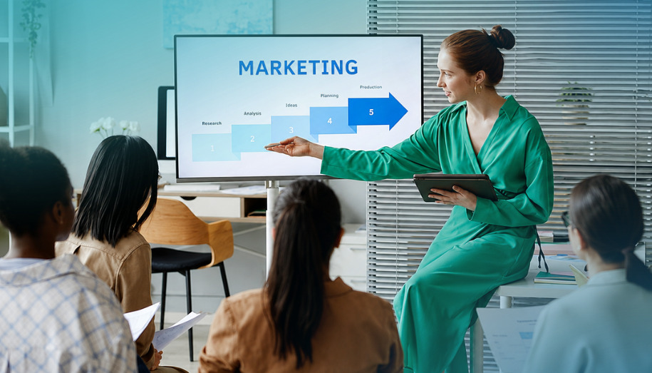 A checklist overlaying a professional workspace, illustrating actionable tips for keeping up summer marketing momentum for a growing business.